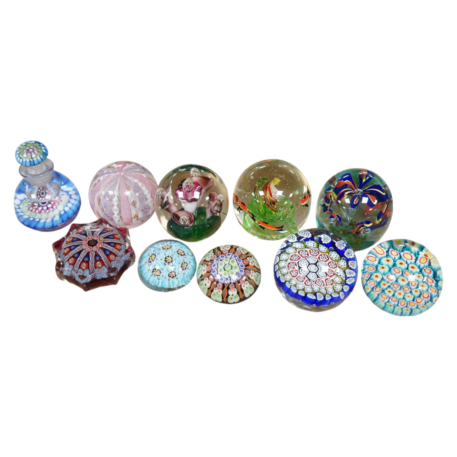 A group of ten paperweights including a ‘scent bottle’ paperweight, 9.5cm. Condition - fair to good